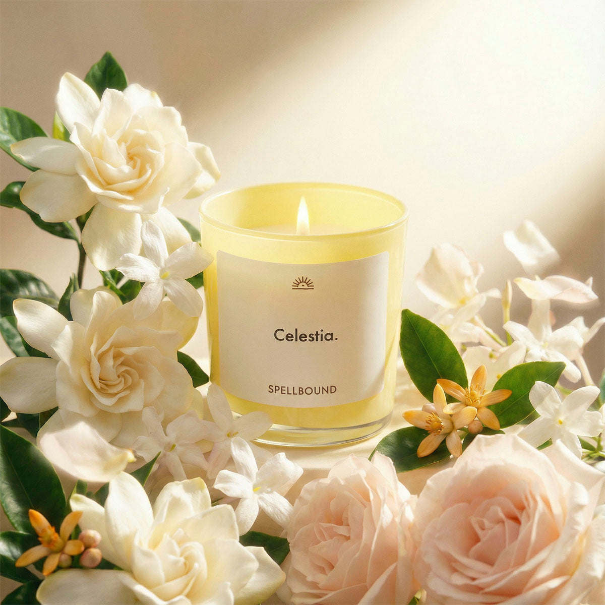 Celestia luxury scented candle surrounded by gardenia, jasmine, roses and amberwood. Premium handcrafted candle with personalised labels by Spellbound.