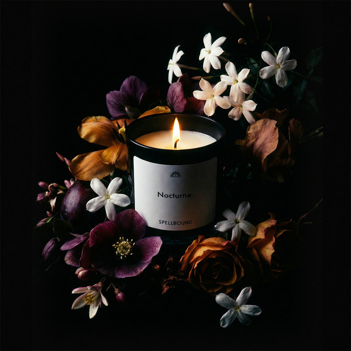 Nocturne luxury scented candle surrounded by frankincense, jasmine, amber & vanilla. Premium handcrafted candle with personalised labels by Spellbound.