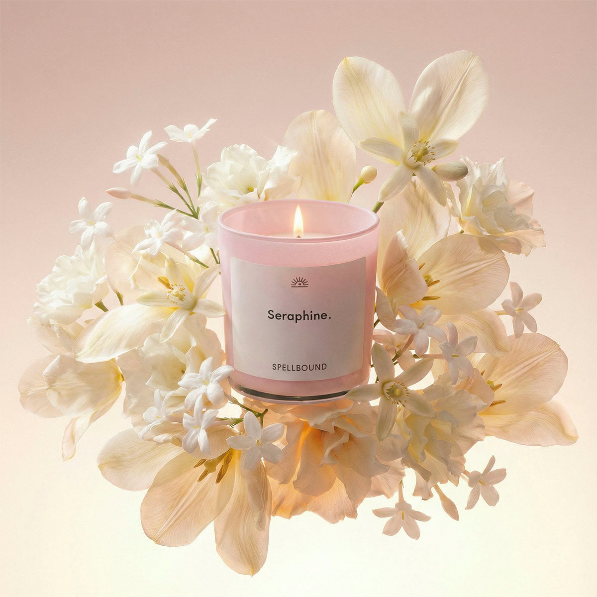 Seraphine luxury scented candle surrounded by lemon jest, jasmine and myrrh. Premium handcrafted candle with personalised labels by Spellbound.
